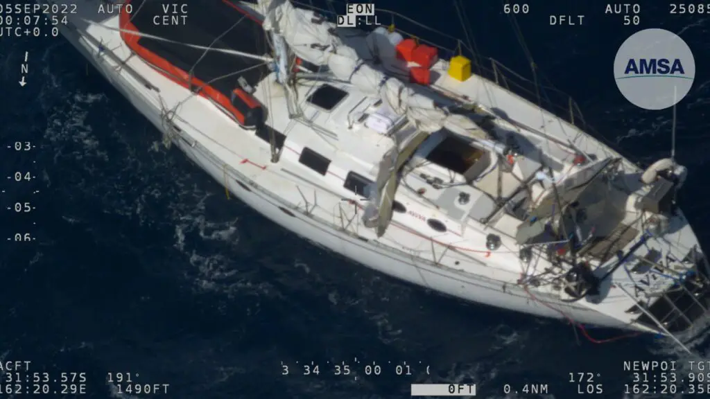 Two men are stranded in the Tasman Sea after a sailboat is damaged by heavy weather